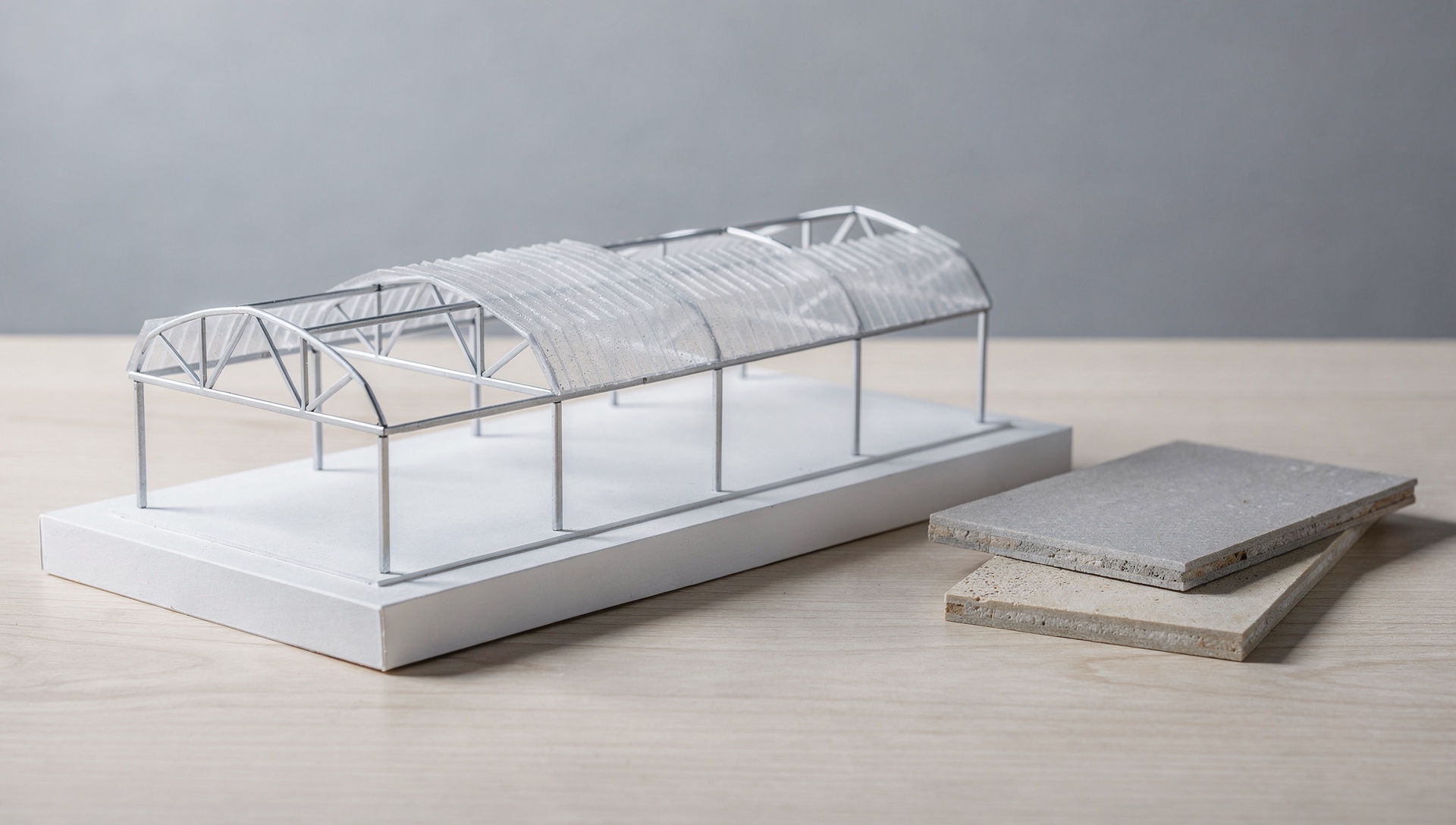AI illustration of an abstract miniature roof structure and two material samples on a table.